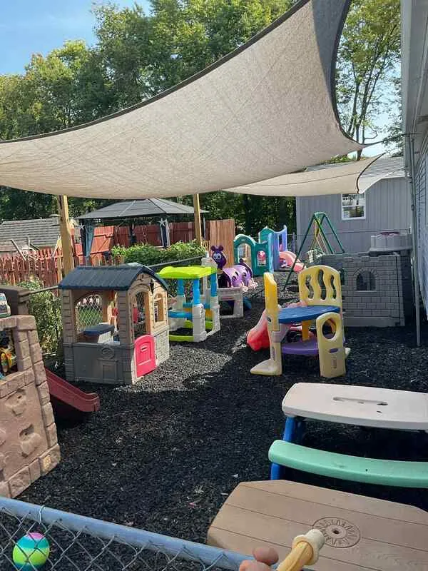 Outdoor playground with new sunshades and rubber mulch